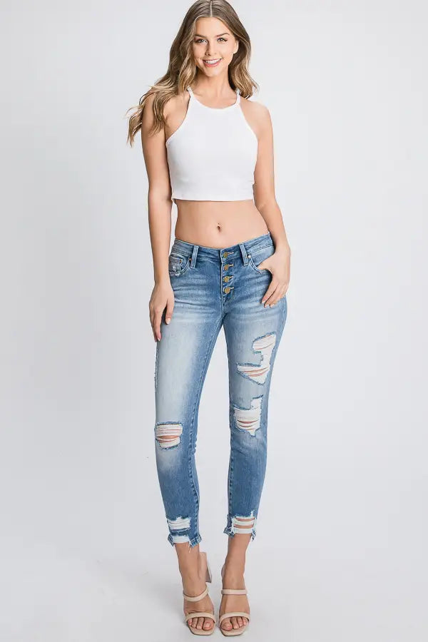 Distressed Mid Rise Button Down Skinny Jeans